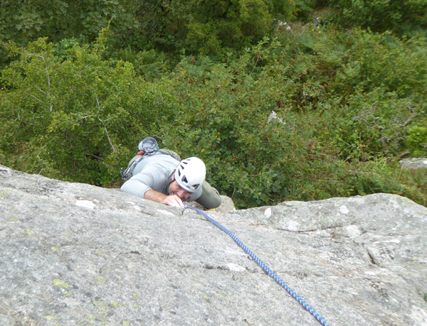 Climbing the route Crackshot at clifton Crag, Galloway. 