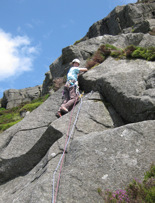 Linda Biggar on the crux slab of Blaeberry Buttress, HS**, during the first ascent July 2009.