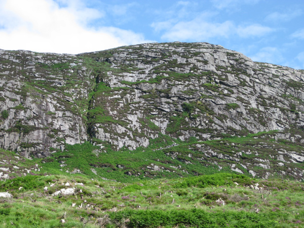 This large rambling cliff, has only seen one route recorded, Pale Face, VS, which takes a line left of the central gully.