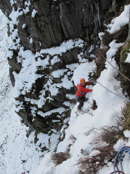 Myself on the third pitch traverse on the first winter ascent of Cooran Gully, III/IV, Dungeon of Buchan, February 2012.